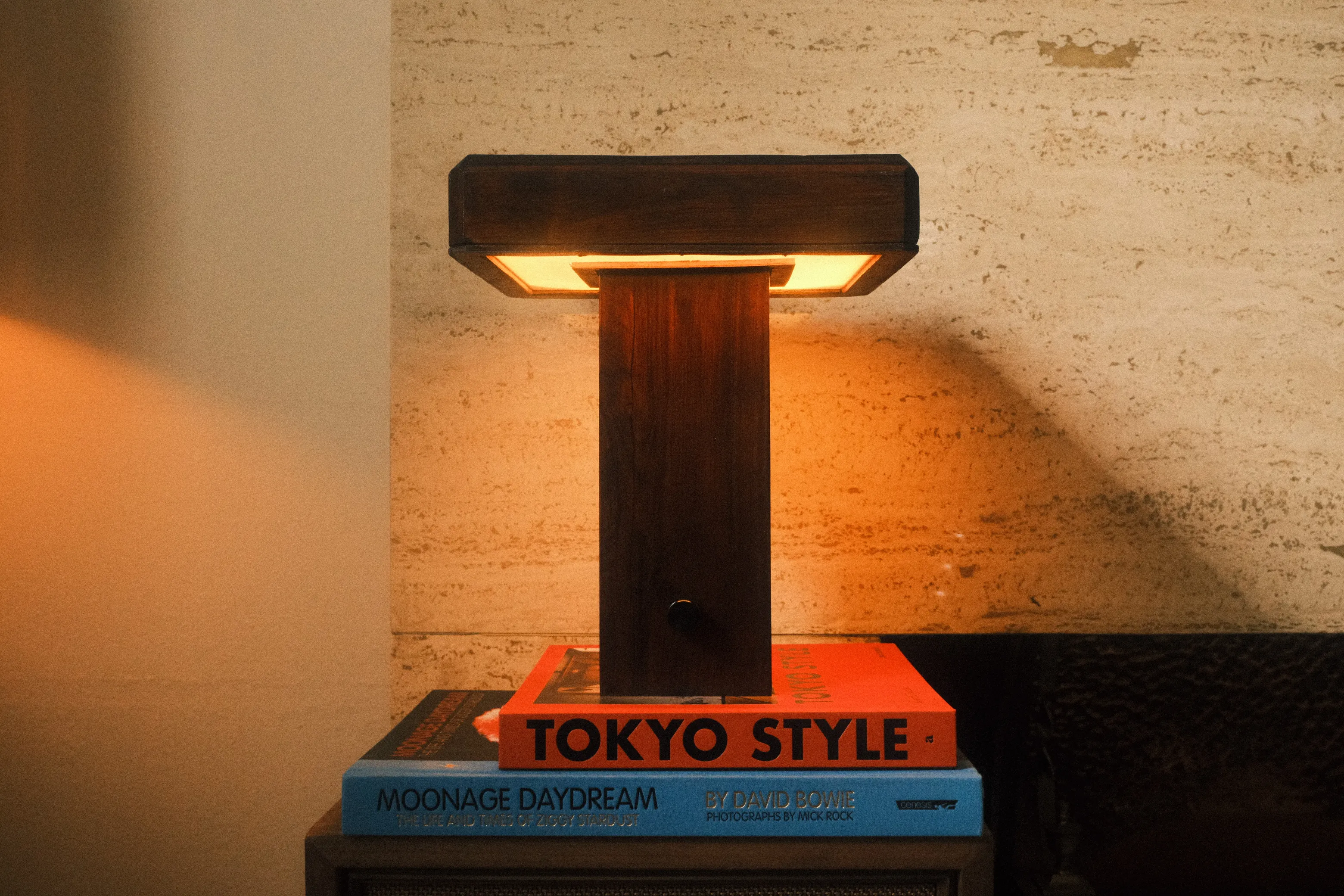 Illuminated timber reading lamp photographed from the front