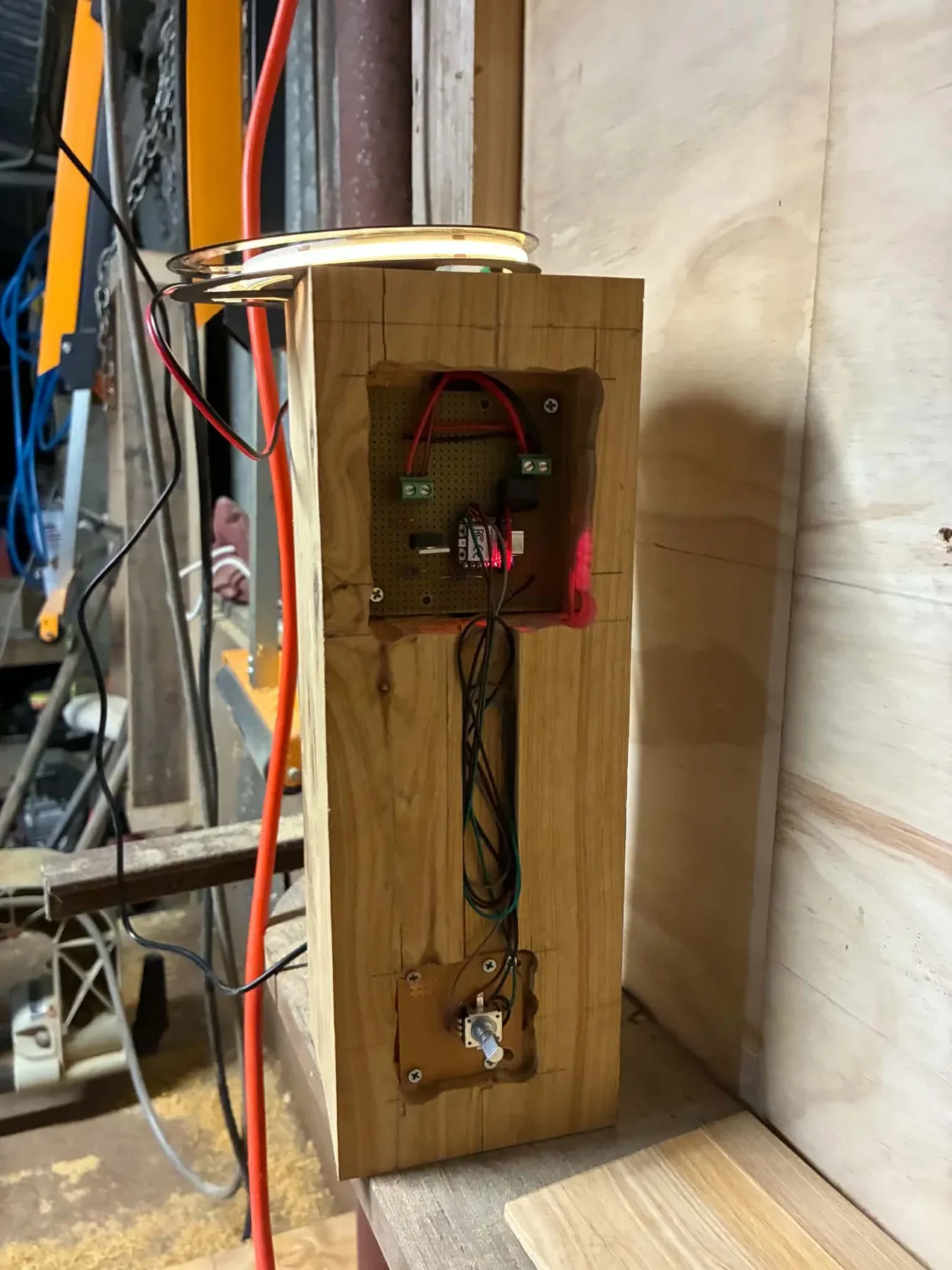Installed controller and wiring inside a routed cavity in the timber base