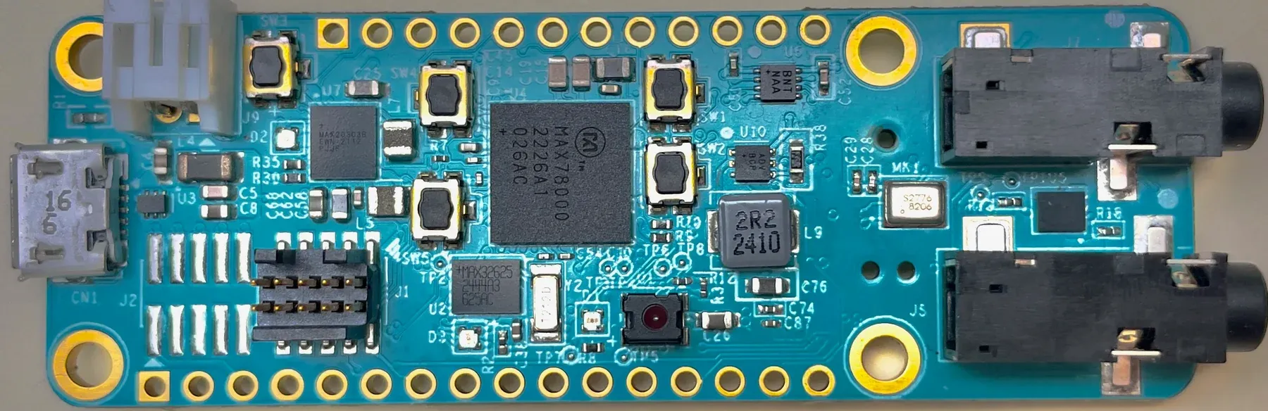 MAX78000 development board, photographed from above, with audio sockets on the right
